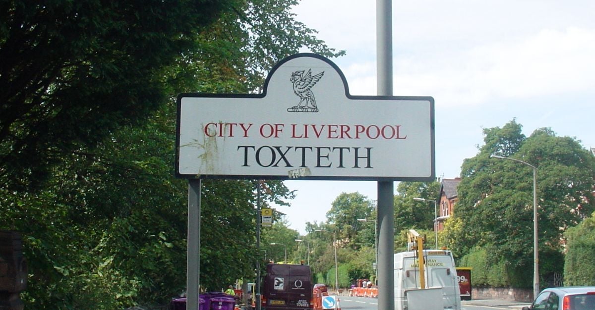 A street sign with the words City of Liverpool Toxteth